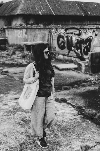 grayscale photo of woman carrying tote bag