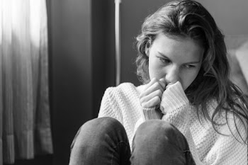 Grayscale Photo of Woman Covering Her Mouth Using Her Hands