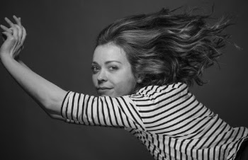 Grayscale Photo of Woman Flipping Hair