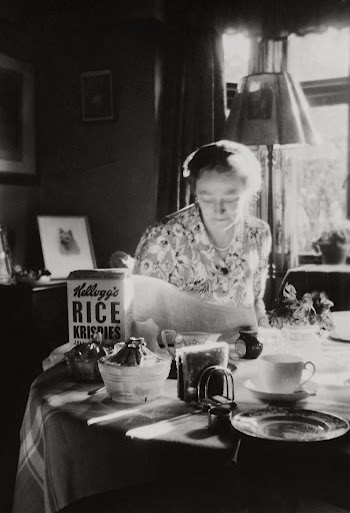 Grayscale Photo of Woman Having Breakfast