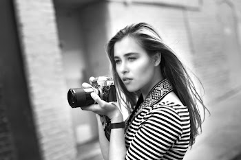 Grayscale Photo of Woman Holding a Dslr Camera