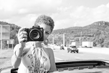 Grayscale Photo of Woman Holding Dslr Camera