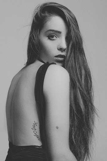Grayscale Photo of Woman in Backless Dress Posing