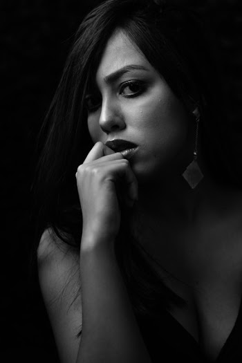 Grayscale Photo of Woman in Black Plunging Neckline Top