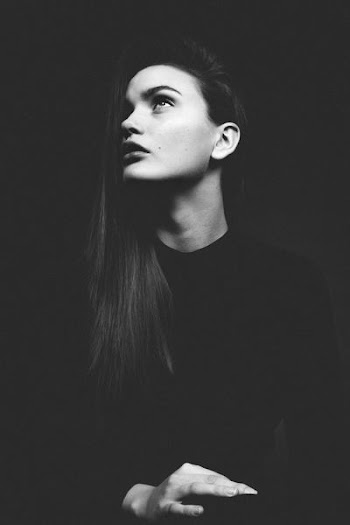 grayscale photo of woman in crew-neck top