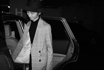 Grayscale Photo of Woman in Jacket