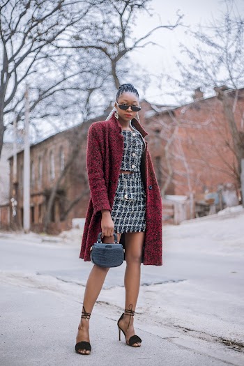 Grayscale Photo of Woman in Maroon Coat