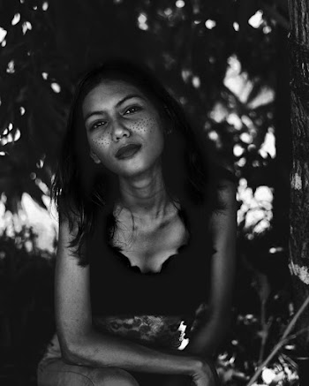 Grayscale Photo of Woman in Sleeveless Shirt