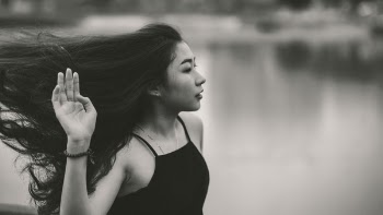 Grayscale Photo of Woman in Spaghetti Strap Top