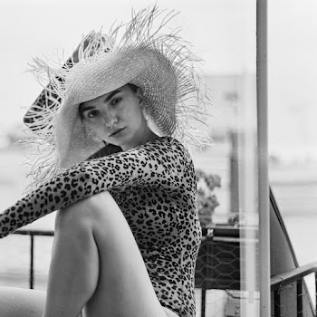 Grayscale Photo of Woman in Straw Hat and Leopard Print Bodysuit