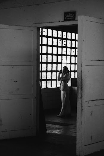 Grayscale Photo of Woman Inside Room