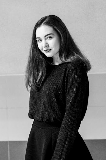 Grayscale Photo of Woman Smiling