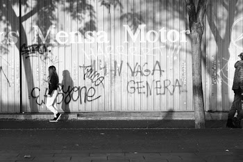 Grayscale Photo Of Woman Walking On Sidewalk