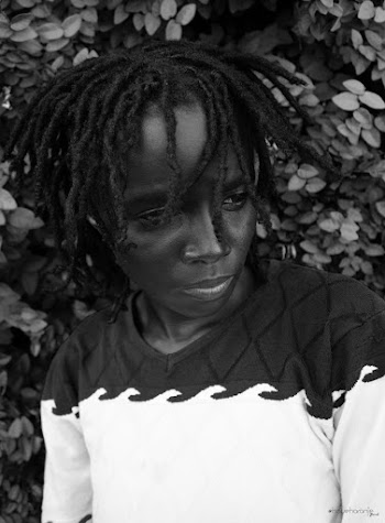 Grayscale Photo of Woman Wearing Dreadlocks