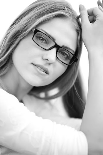 Grayscale Photo of Woman Wearing Eyeglasses