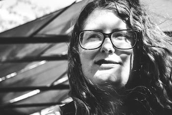 grayscale photo of woman wearing eyeglasses