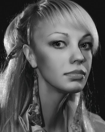 Grayscale Photo of Woman Wearing Floral Dangle Earrings