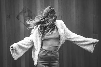 Grayscale Photo of Woman Wearing Fur Coat