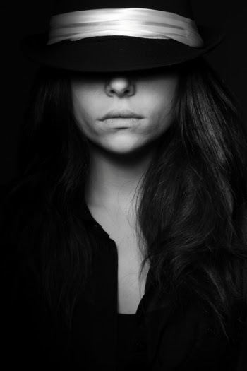 Grayscale Photo of Woman Wearing Hat
