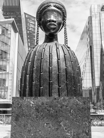Grayscale Photo of Woman Wearing Headdress Statuette