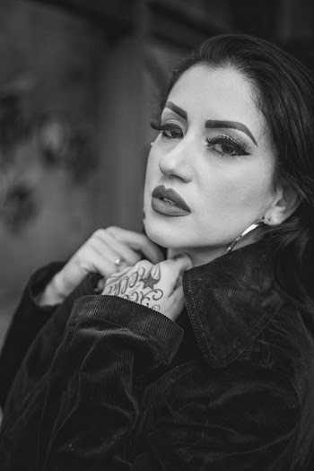 Grayscale Photo of Woman Wearing Jacket