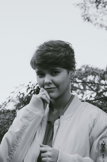 Grayscale Photo of Woman Wearing Jacket