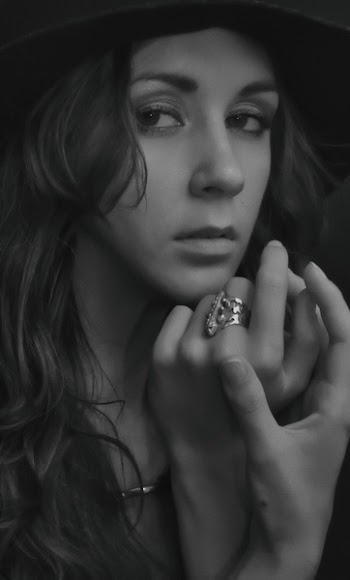 Grayscale Photo of Woman Wearing Ring Looking Sharp