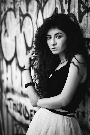 Grayscale Photo of Woman Wearing Sleeveless Top