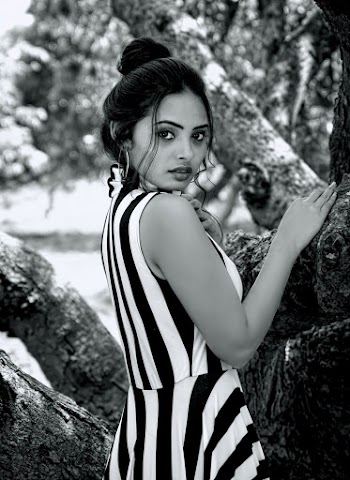 Grayscale Photo Of Woman Wearing Striped Dress
