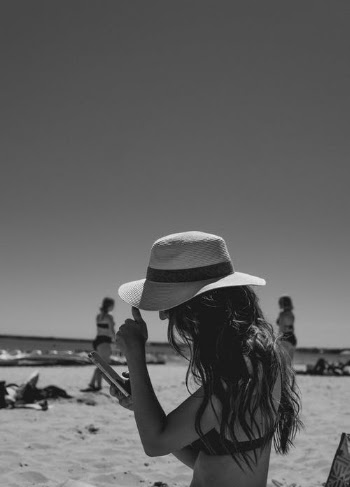 Grayscale Photo of Woman Wearing Sun Hat · Free Stock Photo
