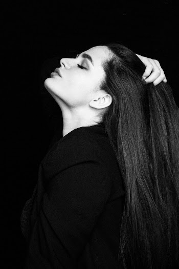 Grayscale Photo of Woman With Her Eyes Closed  Touching Her Hair