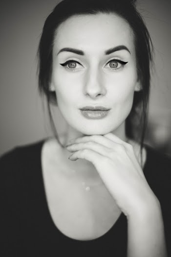 Grayscale Photo of Woman With Her Hand Bellow Her Chin