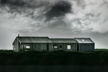 grayscale photo of wooden barn