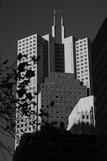 grayscale photograph of high-rise concrete building