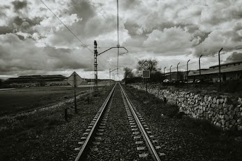 Grayscale Photograph of Train Rail