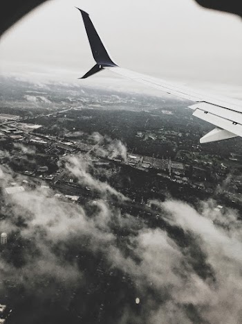 Grayscale Photography Airplane's Left Wing