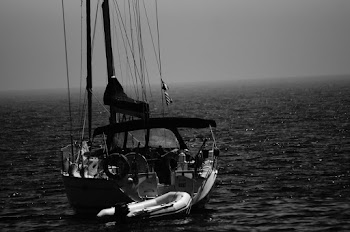Grayscale Photography Boat on Body of Water