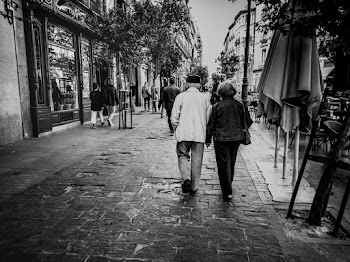 Grayscale Photography Man And Woman Walking