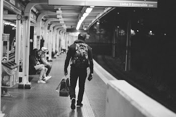 Grayscale Photography Man Walking on Hallway