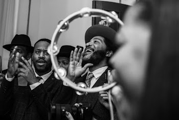 Grayscale Photography of a Group Singing 