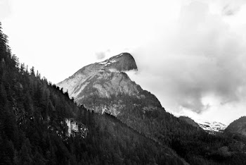 Grayscale photography of a snow covered mountain