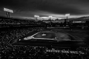 grayscale photography of baseball field with people on bleachers