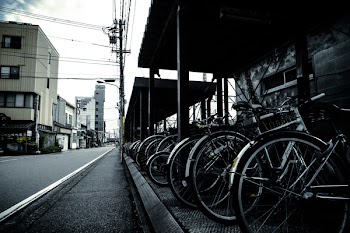 Grayscale Photography of Bikes Park Outside