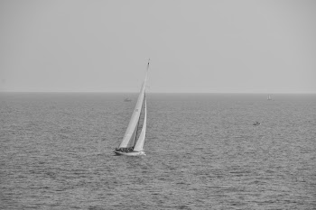 Grayscale Photography of Boat on Calm Body of Water