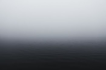 grayscale photography of body of water
