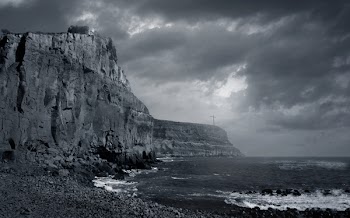 Grayscale Photography of Body of Water Near Mountain