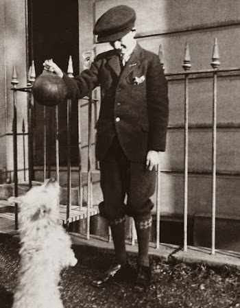 Grayscale Photography of Boy Playing With the Dog