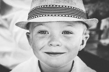 grayscale photography of boy wearing hat