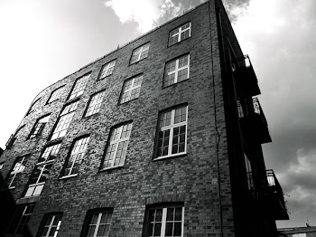 Grayscale Photography of Brick Building