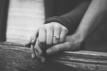grayscale photography of couple holding hands